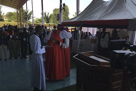 ACNS-AB_Archbishop -Laurent -Mbanda -embraces -Archbishop -Onesphore -Rwaje -as -he -suceeds -him -as -Primate _460x 307